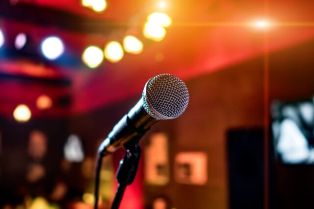 microphone on stage against a background of auditorium